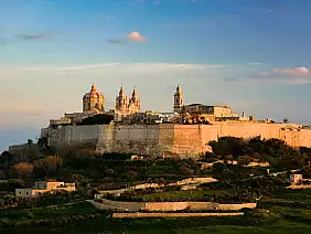 mdina fortress at sunset, malta. view from mtarfa city