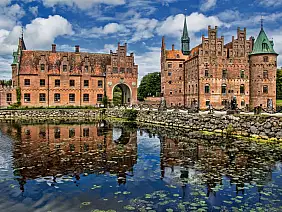 beautiful,water,reflection,of,ancient,castle,in,denmark,called,egeskov