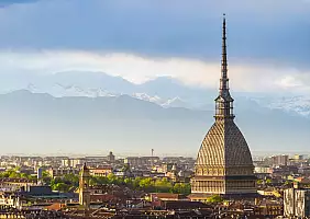 turistipercaso Cityscape of Torino (Turin, Italy) at sunset with storm clouds
