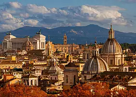 turistipercaso View of Rome historical center old skyline at sunset with autumnal red leaves