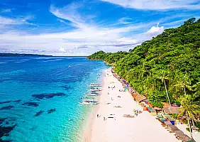 turistipercaso Aerial view of Puka beach in Boracay Island, Western Visayas, Philippines.