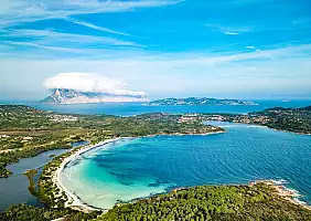 turistipercaso Aerial view of Cala Brandinchi also called Tahiti for its beautiful sea and sandy beach